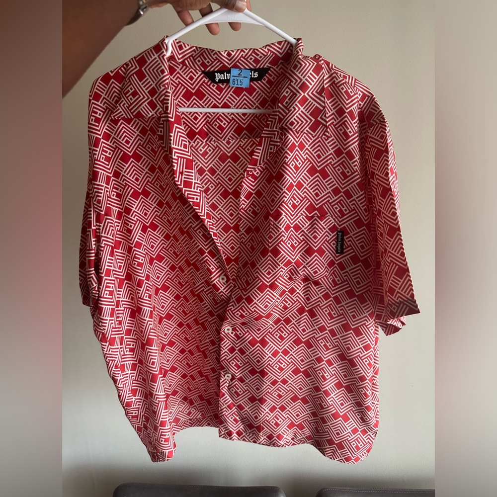 Palm angel shirt. Tiny hole from dry cleaner send offer